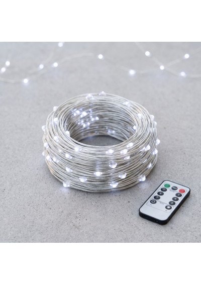šaltai balta Micro LED girlianda Rasa light su sidabrine vielute ir nuotoliniu pulteliu ant betono paviršiaus